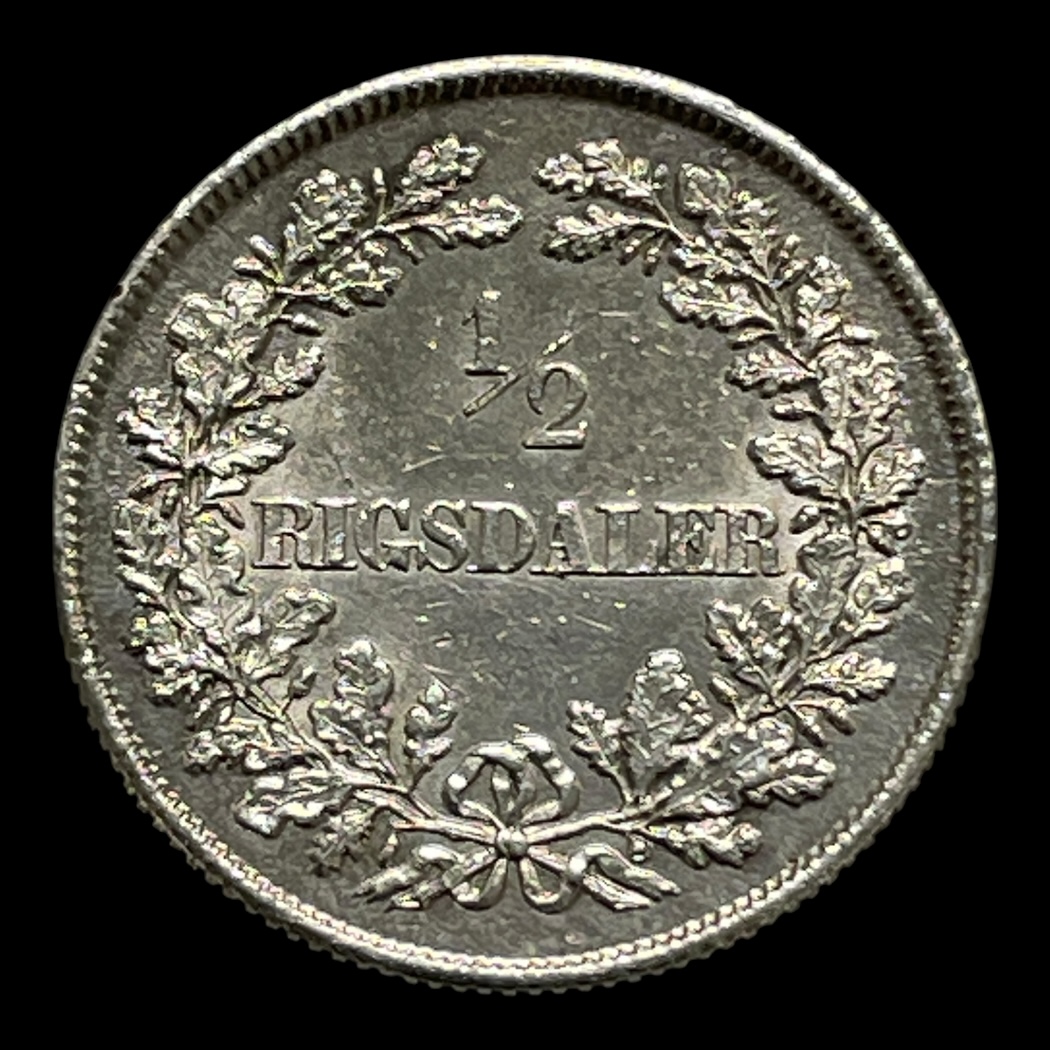 1/2 Rigsdaler 1854vs Sieg 12 H 9 Sølv (.875) Vægt 7,22 gram NB: Tidligere renset!